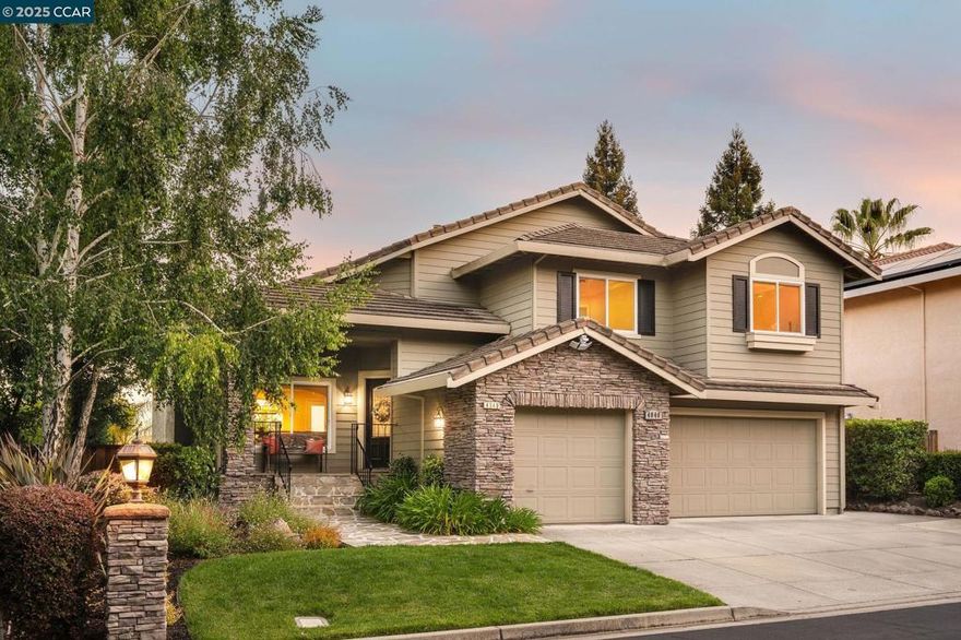 Just WOW! This Northeast-facing home in the gated Bettencourt Ranch community showcases beautiful custom upgrades throughout & scenic views! You're greeted by travertine floors, new interior paint & vaulted ceilings. The spacious living room boasts a stacked-stone gas fireplace flowing into the formal dining area. The highly updated kitchen is appointed w/a breakfast bar island, SS appliances, granite counters, custom cabinetry & easy access to the backyard—perfect for indoor-outdoor living. Just a few steps down, the family room has built-in shelving & fireplace. A bedroom, full bath & laundry room are located on this level, providing flexibility for guests, office use or multi-generational living. Upstairs the primary suite offers hillside views, sitting area & a large dual-entry walk-in closet w/custom built-ins. The spa-like ensuite bath features dual vanities, makeup vanity & jetted tub. 2 front-facing bedrooms & hall bath complete this level. Surrounded by lush landscaping & mature palm trees, enjoy multiple outdoor living spaces including a lawn, deck & patio. 3 car garage, owned solar, whole house fan & newer windows (2020). HOA amenities: tennis/basketball courts, swimming pool, playground & greenbelt. Near top rated schools, Blackhawk Plaza, Tassajara Crossing & trails.