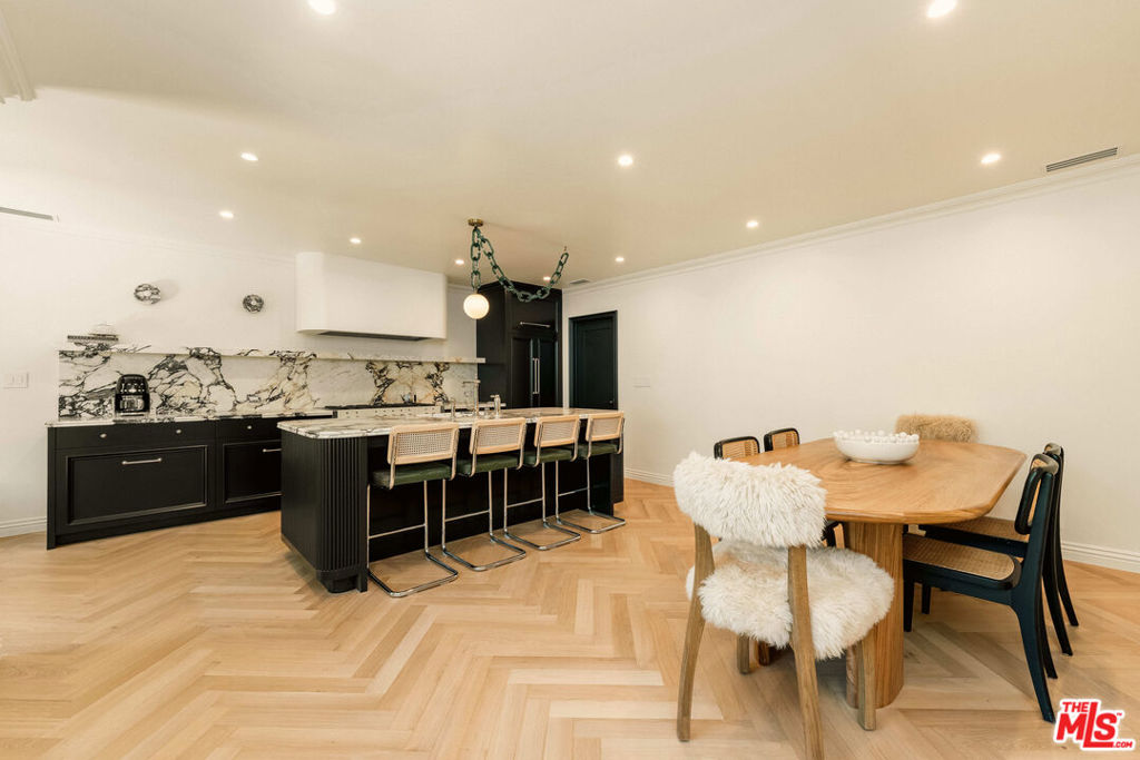 Presenting a rare opportunity to lease a fully furnished, newly remodeled duplex. This sun-filled upper unit features an open layout and natural light as well as sophisticated timeless design with modern amenities and advanced technology. This 3-bedroom, 3-bath residence is just steps from world-class shopping, dining, and entertainment, including Rodeo Drive, Beverly Drive, and the Golden Triangle. Designed for luxury living, the home features herringbone hardwood flooring throughout, Italian viola marble countertops with TuffSkin protection, and brand-new top-of-the-line appliances. A whole-house, three-stage water filtration system ensures purified water at every faucet and shower, While kitchen is equipped with reverse osmosis insta hot water dispenser. Additional highlights include a gas fireplace, central HVAC, smart home technology, in-unit laundry room with custom cabinetry, and a secure gated entry with monitored security cameras. Two dedicated parking spaces are included. Situated within the highly rated Beverly Hills Unified School District, this property offers access to some of the city's top schools and a premier lifestyle in one of Los Angeles' most desirable neighborhoods.