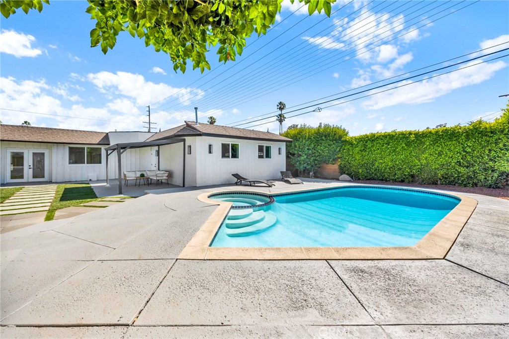 Welcome to this stunning Pool Home with a separate guest house where modern luxury meets everyday comfort. This beautifully remodeled three-bedroom, four-bathroom home spans almost 1900 square feet of thoughtfully designed living space, perfect for those who appreciate both style and functionality. And there is a spacious 560 square foot guest house boasting a private bedroom and bathroom. The heart of this home features a chef's kitchen that would make any culinary enthusiast smile, complete with custom cabinets, gleaming quartz countertops, and restaurant-quality appliances that handle everything from weeknight dinners to holiday feasts plus a walk-in pantry. Fresh paint and new flooring throughout create a seamless flow between spaces, while new windows and exterior doors enhance both comfort, curb appeal and energy conservation. The main residence offers three primary bedroom suites with four bathrooms, providing privacy and convenience for family living. But here's where it gets interesting – a separate guest house includes its own kitchen, bedroom, bathroom, and living room, creating endless possibilities for rental income, multigenerational living, or the ultimate home office retreat. Step outside to discover an entertainer's paradise featuring a sparkling pool and rejuvenating spa plus a large covered area, perfect for hosting gatherings or unwinding after busy days. The thoughtfully designed outdoor space maximizes the generous lot size, creating your own private oasis. This home features Smart Home Technology with a NEST thermostat for optimal comfort and energy efficiency, while the programmable smart lighting systems creates the perfect ambiance for any occasion. There is a large attached 2-car garage with finished walls and plenty of storage. Location couldn't be more convenient – restaurants and shopping are within walking distance, while easy freeway access and nearby public transportation, including local bus and train stations, to connect you to the greater Los Angeles area. There are several parks and nearby recreation, and Trader Joe's ensures grocery runs are never a hassle. This property represents exceptional value in a very desirable neighborhood.