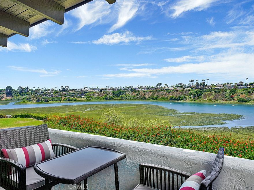 Fully-furnished winter lease available beginning October 18 to May 2026.  Professionally designed by Julia Alt Design, this newly reconstructed three bedroom, two and half bath, attached single family residence has a front row bluff location in The Bluffs offering peaceful and panoramic views of Upper Newport Bay.  This warm, comforting, beach style property is fully furnished with features that include oak wood flooring throughout, custom oak cabinetry in off white and white oak shades, quartzite counters, and custom paint, wallpaper and window coverings.  The chef's kitchen is open to the living and dining area, and offers Thermador stainless steel appliances including a 48" dual fuel range, ice maker, quartz counters, recessed and island pendant lighting, oak floating shelves, wall sconces, gold tone drawer and cabinet pulls, and a fire clay sink.  The living area is warmed by a tile and plaster wood burning fireplace, has a white sectional sofa, ceiling fan and a dry bar with a beverage refrigerator and flows to the newly resurfaced rear patio with a pastoral view setting.  The lower level also provides a powder bath and stylish laundry room with hexagon floor tile, sink and equipped with an LG wash tower.  Upstairs, the primary suite has a King bed, two nightstands, dresser, area rug, and bench seating and offers serene views of the back bay and opens to a balcony shared by bedroom 2.  The second and third bedrooms have Queen beds, two nightstands, wall sconces, dressers area rugs.  Televisions with streaming in each room, internet connected, alarm system, exterior security cameras also present. The Bluffs offers more than 125 acres of open space with unparalleled views, extensive greenbelts, meandering paths, thousands of trees, a reflection pond and easy access to the Upper Newport Bay Ecological Reserve which provides opportunities for hiking, biking, or kayaking.  Neighborhood schools are Eastbluff Elementary and Corona del Mar High School, which is honored as a California Distinguished School. Essential goods are available nearby at Eastbluff Village Shopping Center and the Newport Beach Tennis Club. Fashion Island, Balboa Island, Laguna Beach and other popular OC destinations are just minutes away.