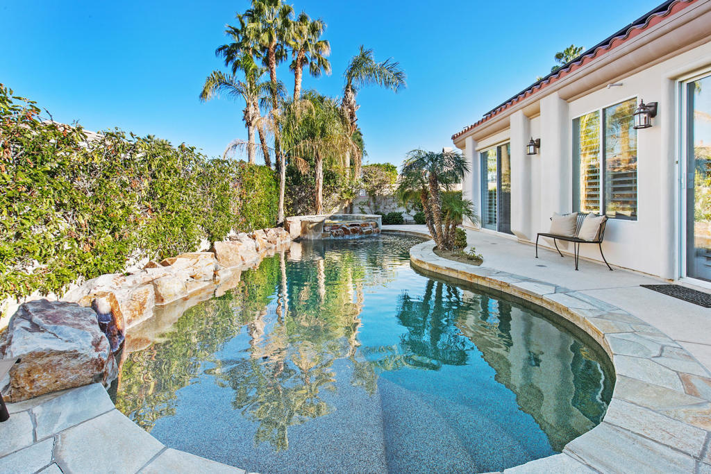 Experience luxury and leisure in the heart of Indian Wells! Nestled in the prestigious gated community of Colony Cove, this wonderful 4-bedroom, 3-bathroom home features a great room that seamlessly integrates a formal living and dining area, creating an ideal space for both relaxation and entertainment. The separate family room, with a cozy fireplace, connects to a spacious kitchen, becoming the perfect gathering spot for friends and family. Whether you're preparing a gourmet meal or enjoying a casual breakfast in the sunlit nook, every moment feels special. The primary bedroom offers a luxurious bathroom with a soaking tub, separate shower, and dual vanities. For entertainment, high-speed internet and flat-screen TVs in the family room and primary bedroom ensure you stay connected and entertained. Step outside to your private backyard paradise, where palm trees sway above a custom saltwater pool and a cascading waterfall spa. The outdoor space is thoughtfully designed for entertainment and relaxation, with a covered patio, plenty of seating, and a BBQ grill. You're moments away from the Indian Wells Tennis Gardens, exquisite dining in nearby La Quinta, and the upscale shopping and dining experiences on El Paseo in Palm Desert. Embrace the blend of luxury, comfort, and accessibility in this exquisite Indian Wells vacation rental. Book your stay now and indulge in a lifestyle where every day feels like a getaway! Jan-Apr $8,500, Oct-Dec $7,000.