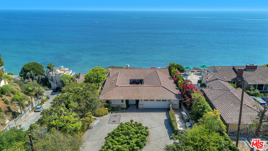 FURNISHED AND AVAILABLE FOR IMMEDIATE OCCUPANCY. Perched above broad and sandy Paradise Cove, sits the ideal Malibu beach retreat. Stunning post and beam, fully appointed and furnished from top to bottom with the very best of everything! Gated compound sits on almost an acre of beautiful grounds. The main residence has sweeping ocean views, 2 bedrooms, 3 baths, a large open concept kitchen, family, dining and living rooms, and a charming central courtyard. There are also two separate guest houses, each with kitchenettes and furnished with full amenities. Enjoy entertaining on the expansive oceanfront patio w/fire pit, outdoor dining area w/BBQ and absolutely incredible 180-degree ocean and shoreline views. Lounge around the sunny pool area or enjoy playtime on the large grassy lawns. Gated path to the beach! All on private/gated Sea Lane Drive. Total bed/bath count is for the main house and guest houses. Floorplans shown in PHOTOS. Call about Summer rates.