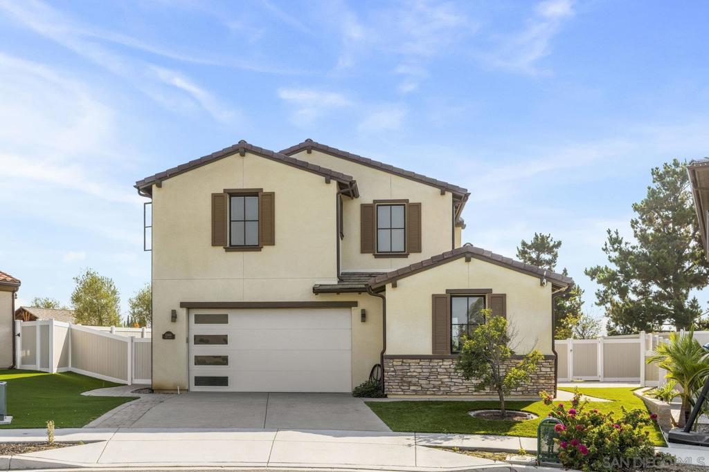 Stunning home on a cul-de-sac in the heart of Poway! Built in 2021, this 2-story home offers an open floor plan w/ soaring ceilings, luxury vinyl flooring & natural light from oversized windows. The gourmet kitchen is a chef’s dream, complete w/ large island & seating, quartz counters, premium KitchenAid SS appliances, custom cabinetry, wine chiller, a massive walk-in & butler’s pantry. Ideal for guests or multi-generational living, each bed offers its own private ensuite bath, including a full bed w/ ensuite bath on the main level. Upstairs, retreat to a spacious primary suite w/ an ensuite spa-like bath & large walk in closet. Step outside to a large, low-maintenance backyard w/ fig, orange, lemon, tangerine, peach, plum & apricot trees, turf, vinyl fencing, & mountain views, perfect for entertaining. Clear view of the Poway Sports Complex 4th of July Firework Show. Additional features include: 2-car garage, water softener & close proximity to top-rated Poway schools, parks, shopping, dining, & easy freeway access. Don’t miss your chance to own this modern gem in one of San Diego's most sought-after communities!
