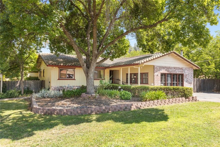 Because the 7.3 kw OWNED SOLAR is paid off, the PG&E true-up bill was only $751.00 for the ENTIRE YEAR in 2024! Beautiful house with all the wish list items: Cul-de-sac, 1.33 acres, POOL, HORSE PASTURE, REMODELED High-end Kitchen (sellers were planning for this to be their forever home and spared no expense on custom cabinets, quartzite counters, farm sink and walk-in pantry with office desk and window and a new half bath). Newer Engineered hardwood in kitchen and entry and hall. WOODSTOVES in both living rooms with custom rock hearths. HUGE, detached GARAGE with air-conditioned office/ 4th guest room that has ADU/ mother-in-law unit potential, workshop with wood stove, tack room, hay shed, fenced and cross fenced. Very quiet and private yet moments to shopping and walking distance to school. OUT-DOOR KITCHEN on large covered fenced patio, various sheds and dog runs, and garden areas with established landscaping. Tons of room to park RVs, BOATS, HORSE TRAILERS. Primary bedroom has remodeled bathroom with low threshold custom stone and tile shower and HEATED FLOORS. Glass doors from primary bedroom lead to the pool and offer views of the covered patio, pool, horse pasture and lush olive groves. Wheelchair ramp to front door and paved parking in front. Second living room has its own entrance and beautiful exposed antique beams with adze marks and tons of natural light and cozy window seats with storage benches. Spanish tile roof and custom brick work make this the perfect blend of county ranchette and cozy home with luxury upgrades and potential for second unit--on Sewer, not septic, which makes additions much easier. In-ground gunite pool was resurfaced about 6 years ago and has an outdoor bathroom and lots of storage for pool floaties and equipment. Security fence separates it from the outdoor kitchen for added water safety. Woodstoves add charm and warmth. House also has a newer central heat and air system installed in 2013. Solar Installed in 2019 and is included with sale with $0 owed. Potential to rent out pasture to horses for supplemental income.