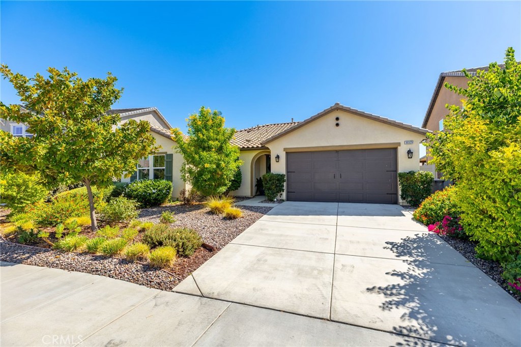 Single story 1860 sq. ft. home in the Mahogany Hills community featuring 3 bedrooms, 2 bathrooms, and a versatile den with built-in shelving— suitable for a home office, playroom, or easily convertible into a 4th bedroom.
Open concept floor plan, with expansive kitchen includes 10-foot island and huge great room, quartz countertops with plenty of storage.
Laundry room offers excellent functionality with built-in storage, a drying rack, and a new washer. Additional upgrades include tankless water heater, Owned Solar System with 16 panels and a SolarEdge battery for nighttime energy use.
The primary suite includes a walk-in closet and a private bath. Outdoors, you’ll find two covered patios, an outdoor TV, and a Cal Spa jacuzzi. The yard is a retreat, offering shade and privacy with mature trees—including peach, nectarine, and lime—along with a veggie garden bed and drought-tolerant landscaping in both the front and back.
Located in the Mahogany Hills a community with low HOA fees, with green space, scenic walking paths, and three playground parks. Minutes from shopping, dining, and freeway access.
All appliances convey;