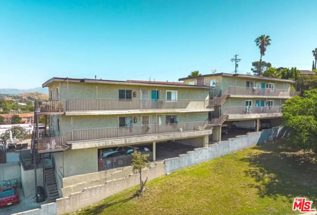 Outstanding investment opportunity in the heart of Boyle Heights! This well-maintained 8-unit apartment building, built in 1948, boasts strong current income and significant value-add potential. All 2-bedroom, 1-bathroom units average 754 SF with potential to increase income to market rent. Additionally, a feasibility study and preliminary architectural plans for 2 additional ADU's have been performed, allowing for a total of 10 units. These are new construction units proposed to be ADUs over the parking area and simultaneously satisfy retrofit requirements. Perched on a 9,293 SF lot, this property enjoys hillside views, extensive parking provided by 22 spaces, and a strategic location ideal for families. This property is a rare opportunity to capitalize on the strong Boyle Heights rental market and achieve robust long-term returns.