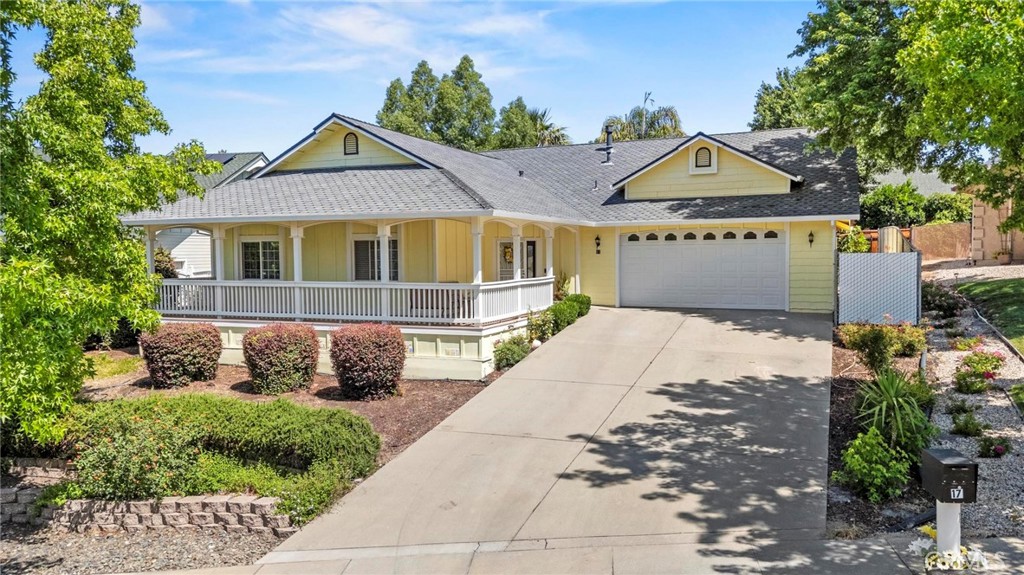 Welcome to a truly exceptional residence that embodies refined living, timeless design, and everyday comfort. Nestled on a quiet cul-de-sac in one of the most sought-after neighborhoods, this elegant 3-bedroom, 2-bath home offers 2,107 square feet of thoughtfully designed living space on a beautifully landscaped 0.18-acre lot. Built in 2004, this residence seamlessly blends classic charm with modern amenities, providing an unparalleled living experience. From the moment you arrive, the home's curb appeal is undeniable. A gracious wrap-around front porch sets the stage for the warm and inviting interior that awaits. Step inside to soaring ceilings, graceful crown molding, dual-paned windows, and an open floor plan that allows natural light to pour in, creating an atmosphere of airy sophistication. The main living spaces are accented by exquisite custom scraped wood flooring, while a tasteful combination of laminate and carpet provides texture and comfort throughout. The kitchen is a true showpiece, designed to delight the most discerning chef. Granite countertops, a decorative tiled backsplash, and an undermount double basin sink offer both beauty and function. A convenient pass-thru window with breakfast bar invites conversation, while a full suite of stainless appliances—including dual ovens (electric and convection), a microwave, and dishwasher—ensures effortless meal preparation. A spacious pantry completes the space, offering ample storage. The adjacent dining area is perfect for intimate dinners or festive gatherings, while the elegant living room—with custom built-ins and a cozy fireplace—creates a perfect setting for relaxation or entertaining in style. The private primary suite is a luxurious sanctuary, featuring a generous walk-in closet, spa-like soaking tub, expansive walk-in shower with dual shower heads, dual vanity sinks, and a private water closet. Guests will enjoy their own well-appointed bath with dual sinks, a tub/shower combination, and convenient linen storage. A dedicated indoor laundry room with extra cabinetry further enhances the home’s functionality. Step outside to your own personal oasis. The covered and tiled back patio invites alfresco dining and serene morning coffee, while the fully fenced yard with garden beds and lush landscaping offers a peaceful retreat. The attached garage provides ample space for vehicles and storage. A rare opportunity to own a home of this caliber—don’t let it pass you by.