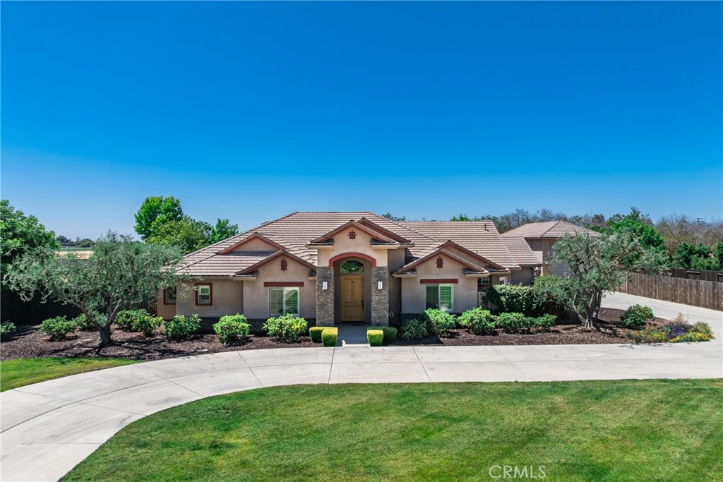 Welcome to your Custom Dream Home in the prestigious gated community of Montecito Ranch Estates on 1.15 acres with an RV Garage & Owned Solar in Hanford, CA. This beautifully designed 4-bedroom, 3-bath home offers 2,781 sq ft of thoughtfully crafted living space, perfect for those looking for a unique property. Built in 2012, this property boasts an open-concept layout with high-end finishes throughout. The gourmet kitchen features a built-in Thermador refrigerator, oven & warming drawer, a vegetable sink, a large walk-in pantry, and a large island ideal for entertaining. Enjoy seamless indoor-outdoor living with a covered patio complete with an outdoor kitchen—perfect for weekend BBQs or relaxing outdoors. RV/Car enthusiasts will love the oversized RV garage and additional 3-car garage, offering ample space for vehicles or a workshop. Don’t miss the opportunity to own this custom home in one of Hanford’s most sought-after neighborhoods. Call Today for a private tour!