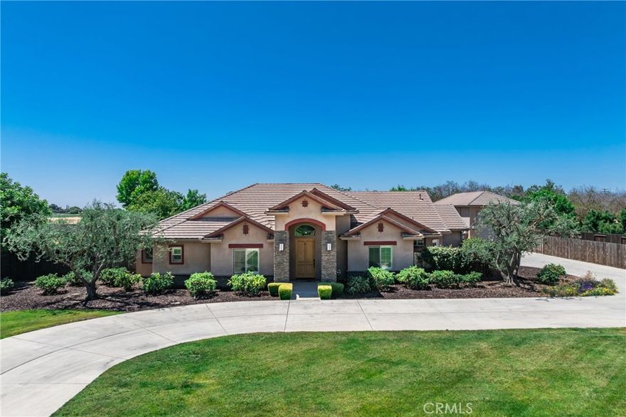 Welcome to your Custom Dream Home in the prestigious gated community of Montecito Ranch Estates on 1.15 acres with an RV Garage & Owned Solar in Hanford, CA. This beautifully designed 4-bedroom, 3-bath home offers 2,781 sq ft of thoughtfully crafted living space, perfect for those looking for a unique property. Built in 2012, this property boasts an open-concept layout with high-end finishes throughout. The gourmet kitchen features a built-in Thermador refrigerator, oven & warming drawer, a vegetable sink, a large walk-in pantry, and a large island ideal for entertaining. Enjoy seamless indoor-outdoor living with a covered patio complete with an outdoor kitchen—perfect for weekend BBQs or relaxing outdoors. RV/Car enthusiasts will love the oversized RV garage and additional 3-car garage, offering ample space for vehicles or a workshop. Don’t miss the opportunity to own this custom home in one of Hanford’s most sought-after neighborhoods. Call Today for a private tour!