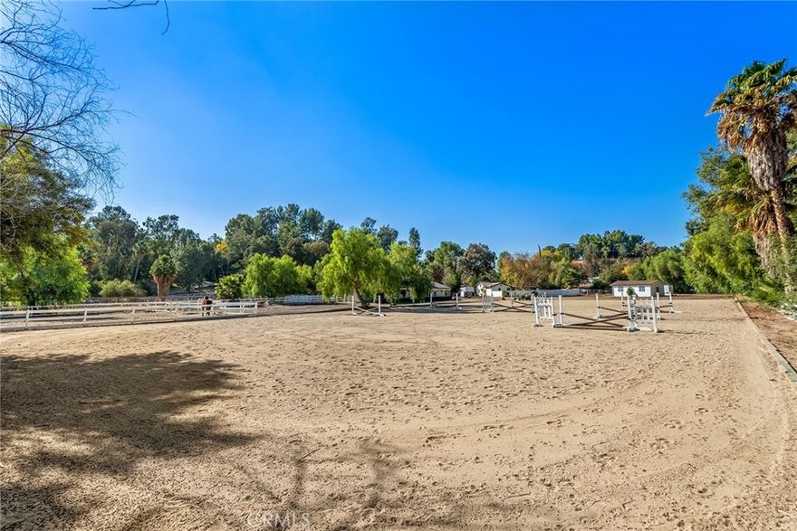 This spectacular, all flat 2.33 acre lot is sited at the very end of a quiet cul de sac. This super prime lot is suitable for a large estate home with a guest house, separate gym, equestrian facilities, tennis court, huge yard, fruit orchard and much more. This is one of the very largest flat lots in the entire city and very rarely does a lot like this become available. Seller has a preliminary floor plan and elevations for a new custom home, plus outbuildings, on the property done by noted architect Richard Landry. These plans and soils/geology reports are available. This is a land value sale only and the existing small home and stable on the property are sold as-is. Don't miss this one!