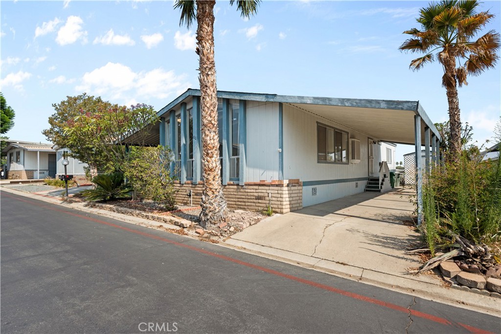 Best price and best condition in the community! This updated 2-bedroom, 2-bath home at 1550 Rimpau Ave #39 in Corona features bathrooms that have some updates, a refreshed kitchen, and an upgraded laundry room floor. The open floor plan with vaulted ceilings is filled with walls of windows with natural light, and the primary suite offers a private bath. Additional highlights include indoor laundry, a covered carport, and a private patio. Enjoy resort-style community amenities including pool, clubhouse, and playground—all in a prime Corona location near shopping, dining, and freeways.