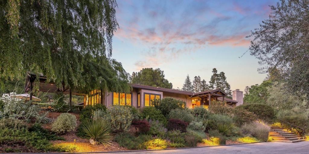 From its Westridge location on approximately 2.55 acres, this stunning home has absolute privacy and views out to Windy Hill. The house is nestled in a tranquil setting with beautiful mature trees and native plants that evoke a feeling of elegance and nature reminiscent of the wine country. Well-appointed interiors and custom finishes appear at every turn while skylights and sliding glass doors add amazing natural light. A formal living and dining room are complemented by a tremendous kitchen and family room combination that opens to a vast terrace for indoor/outdoor living. There are 4 bedrooms and 3.5 baths plus an office or project room and amazing space in the converted barn for recreation, media, and fitness. A pool and spa are served by a cabana with changing rooms while native plants, and a vegetable garden add eco-friendly touches. Topping it all off is the homes close-in Westridge location putting hiking and riding trails, and top-rated schools all within easy reach.