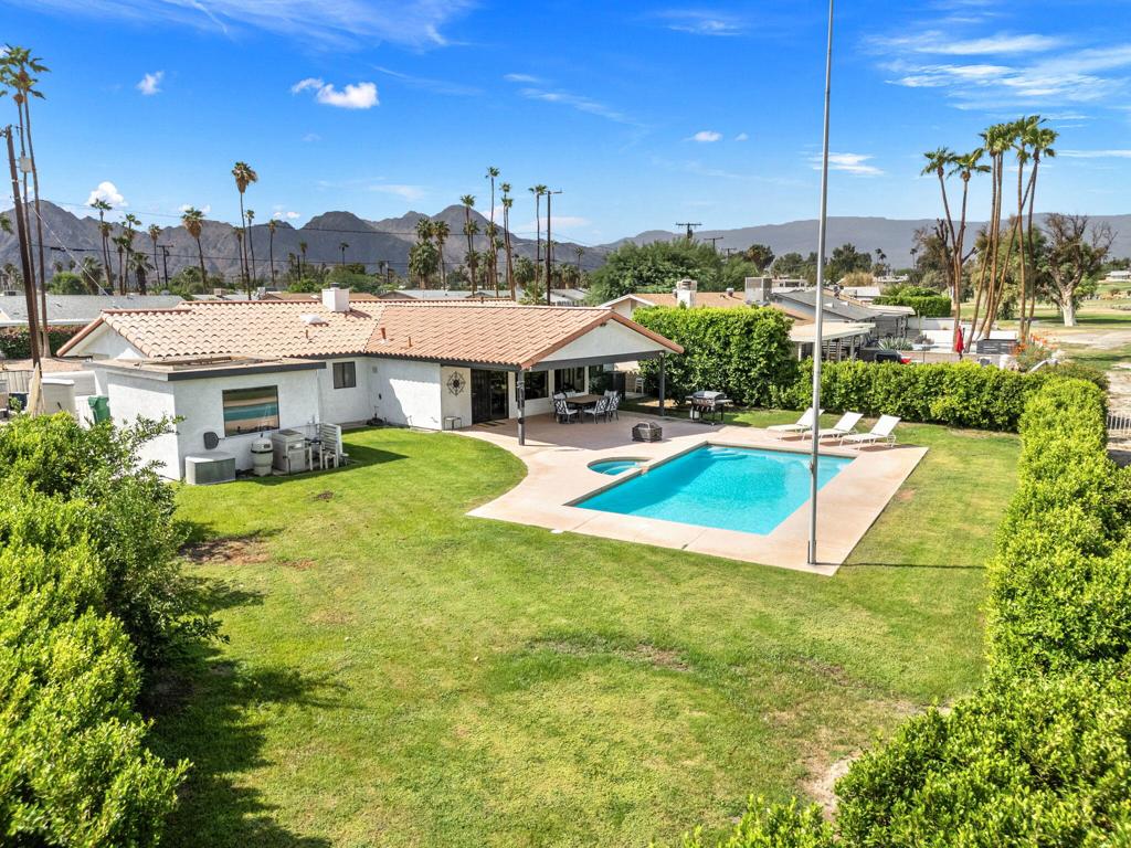 Welcome to your desert oasis in the heart of Palm Desert Country Club. This nicely appointed home offers comfort, style, and convenience, with a scenic fairway view. Step inside to find a bright and open floor plan with neutral tones and plenty of natural light. The spacious living area flows seamlessly into the kitchen -- perfect for entertaining or relaxing at home. The primary suite includes a large closet and en-suite bathroom, while two additional bedrooms offer flexibility for guests, a home office, or family needs. Enjoy desert evenings in your private backyard with a beautiful pool and spa, mature landscaping, a covered patio, and plenty of room to relax or dine al fresco. There is a one-car attached garage, a separate golf-cart garage for extra storage, and ample driveway parking. This home offers a great blend of tranquility and accessibility - we look forward to your visit.