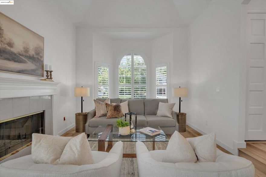 Located on a desirable corner lot behind the gates of Apple Hill Estates, this beautiful 4-bedroom, 3-bath home blends space, comfort, and style. Highlights include engineered wood flooring, plantation shutters, vaulted ceilings, nightlight feature lighting, a first-floor air filtration system, water softener, solar, and whole-house fan.  The main level features formal living and dining rooms, a spacious family room with a cozy fireplace, and sliding doors leading to a covered deck and private backyard. The rear-facing kitchen offers granite counters and backsplash, breakfast bar, nook, pantry, and abundant cabinetry. A downstairs bedroom and full bath are perfect for guests or multi-gen living.  Upstairs you'll find more bedrooms, a guest bath, and a large primary suite with vaulted ceilings, walk-in closet, dual vanities, sunken tub, and stall shower. A generous laundry room adds convenience with upper/lower cabinets, sink, and folding space.  Enjoy a private backyard with mature landscaping and patio. Apple Hill Estates offers a pool, spa, clubhouse, tennis/pickleball and basketball courts, year-round events, and 24-hour guarded gate. Welcome home.