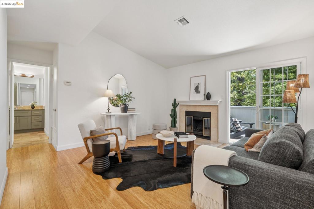 Embrace peaceful living in the Oakland Hills: A delightfully updated condo surrounded by greenery with superb amenities. Located within the gated Shadow Woods community, your eyes are immediately drawn to the lush trees and open spaces, with close proximity to hiking trails and East Bay Regional Parks. This top-floor corner unit stands out as a coveted residence. The living room features a cozy fireplace, vaulted ceiling, and direct access to a spacious deck beautifully surrounded by redwood trees. The modern kitchen boasts stone countertops, stylish tile backsplash, stainless steel appliances, and generous storage. Conveniently located off the kitchen is an in-unit laundry room equipped with additional shelving. Both of the sizable bedrooms are ensuite and feature sliding glass doors leading to the deck, along with generous walk-in closets. Despite its convenient location near recreational activities, shopping, and freeway access, the community's impressive amenities—which include a swimming pool, jacuzzi, clubhouse, tennis courts, sauna, and playground—might make it hard to leave home. Come and experience it for yourself!