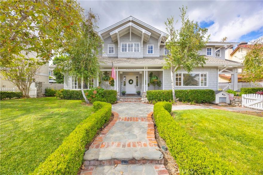 Welcome to 23181 Via Celeste, a stunning modern farmhouse estate that blends timeless character with the best of today’s upgrades. Perfectly positioned behind the gates of Coto de Caza, this 5-bedroom, 4.5-bath home plus office, bonus room, and guest suite offers the perfect mix of style, function, and resort-style living.



Step inside to bright, open living spaces with rich hardwood floors, crown molding, and designer lighting throughout. The chef’s kitchen features coffered ceilings, quartz countertops, a massive island with bar seating, top-of-the-line stainless-steel appliances, and a walk-in butler’s pantry—ideal for entertaining or everyday ease.



Enjoy multiple spaces to gather and dine. A warm and inviting formal dining room showcases brick floors and a matching fireplace for timeless charm, while the adjoining family room centers around a custom brick fireplace and built-in entertainment wall.



Upstairs, the primary suite impresses with vaulted ceilings, a spa-inspired bath featuring a freestanding soaking tub, dual vanities, quartz counters, and a glass walk-in shower. Four additional bedrooms complete the upper level, including one with its own ensuite bath, along with a spacious office and convenient upstairs laundry. As an super bonus, this home also hosts an additional room off the garage downstairs, that currently serves as a 6th bedroom/guest quarters.



Step outside to your private resort. The backyard boasts a sparkling pool with water slide, spa, grotto, LED lighting, and outdoor shower. A covered outdoor kitchen with built-in BBQ, seating area, and fire pit sets the stage for unforgettable gatherings. A large balcony with fireplace and gas heater is perfect for cozy evenings, while a gated courtyard with built-in basketball hoop adds a playful touch for all ages.



Additional highlights include paid solar, whole-house water filtration, 220V EV plug, extra storage room, and a long driveway with ample parking. Every inch of this property delivers modern luxury, comfort, and that unmistakable Coto lifestyle.