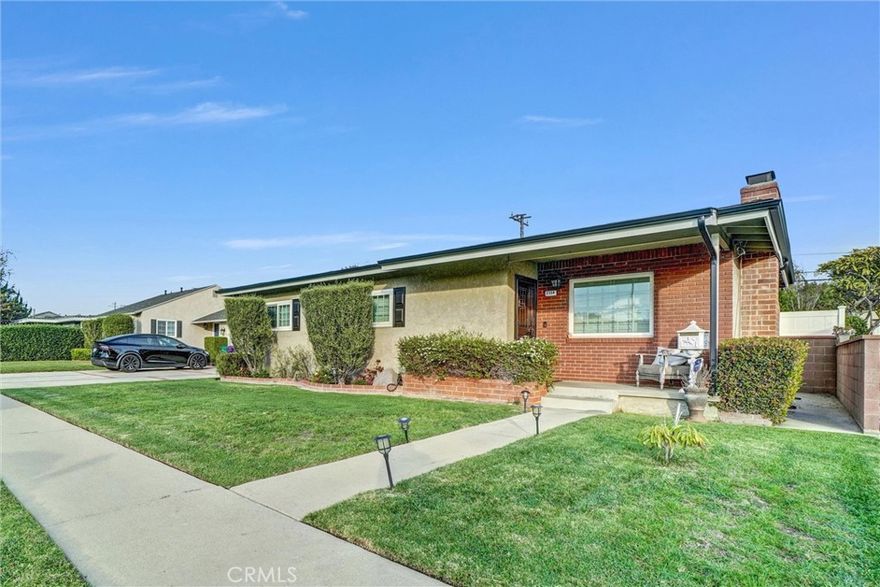 Welcome to this beautifully upgraded Los Altos lease in Long Beach, offering effortless freeway access and a bright, inviting layout designed for comfortable everyday living. From the moment you arrive, you’ll notice the thoughtful finishes and the seamless indoor-outdoor flow that makes this home truly special. Inside, enjoy hardwood floors throughout, crown moulding, fresh designer paint in a modern, trendy palette, and elegant crystal chandeliers that elevate the space. The living room feels airy and refreshed with a brand-new ceiling fan, updated windows, and abundant natural light. Bedrooms feature charming wainscoting/bead board details plus generous storage found throughout the home. Plantation shutters and blackout shades provide style and comfort when you want a quieter, shaded space. The kitchen is a showstopper with brand-new quartz countertops, a dramatic waterfall edge, matching backsplash, Kohler farmhouse sink, and a new dishwasher—perfect for both daily use and entertaining. The bathroom continues the high-end feel with striking quartzite stone, a vessel sink, and polished finishes. A standout bonus room/sunroom adds flexible living space and is wrapped in 25 brand-new windows, creating a sun-drenched retreat ideal for a home office, playroom, gym, or relaxing lounge. Step outside to a spacious backyard with raised garden beds ready for vegetables or flowers, plus a lovely sunroom connection, outdoor patio, and plenty of space to unwind or gather with friends. Additional highlights include Dutch doors, a brand-new 2-car garage door and motor, and an electric car charging port for modern convenience. This is a rare opportunity to lease a move-in-ready Los Altos home with premium upgrades, abundant light, and a backyard built for enjoying Southern California living.