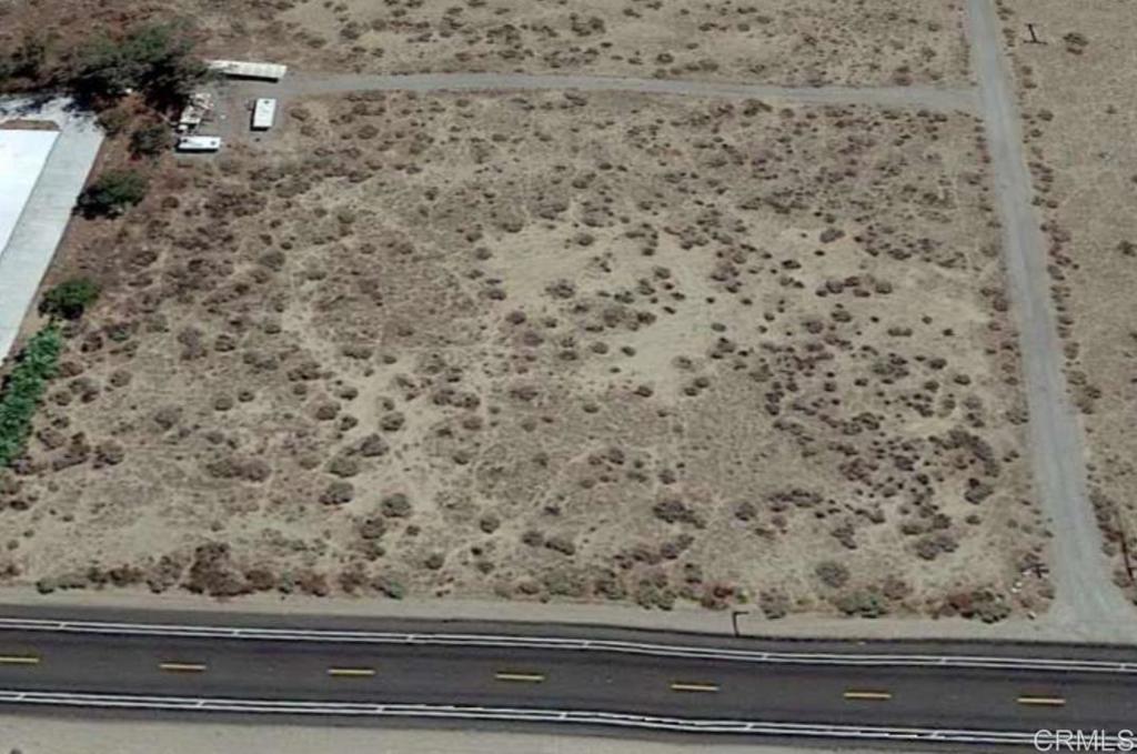 Come enjoy the desert culture of metal art, intricate shops, golf courses, hiking, riding, artist displays, starry nights, and more. Sale includes 2 5th wheels and jobsite trailer. Level land next door to Peg Leg storage. 308' of frontage on S22 at mile marker21. In between the elementary school and Regional Airport with both residences and businesses near by.