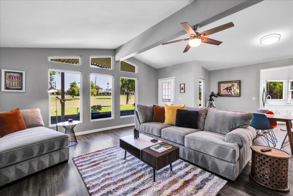 This beautifully updated home features 2 bedrooms, 2 baths and den in 1692 square feet. The open plan public rooms have vaulted ceilings, clerestory windows, a large entertainer's eat-in kitchen, custom window treatments and all stainless kitchen appliances. Large, clean-as-a-whistle bathrooms, an in-house laundry room, three covered parking spaces and a large storage shed add exceptional value to this home. Good quality laminate flooring throughout. This Light, bright and airy home is offered turn-key-furnished and move-in ready. Lively Adult Living in Suncrest Country Club - 55+ Community, inviting FAIRWAY residence situated in this vibrant community in the heart of Palm Desert . Suncrest offers an array of premium amenities including a beautifully maintained 9 hole regulation golf course, tennis courts, pickleball, a putting green, billiards room, community library, welcoming cafe, and a fully stocked pro shop--this community caters to an active and social lifestyle. There is no HOA. The lease is $1,099 per month BUYER MUST GET PARK APPROVAL.
