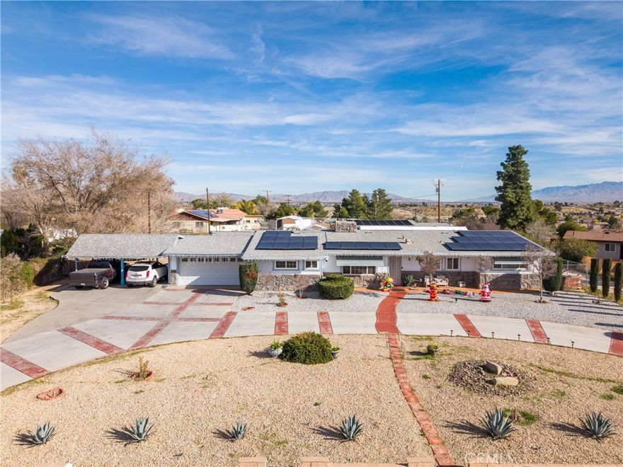 Come take a look at this amazing property featuring a pool, RV access, a spacious .84 acre lot and a detached studio style structure. The main residence features 3 bed 3 bath and 1960 square feet of living space and a modern kitchen with granite countertops, and a huge laundry room. The detached studio style structure of 740 square feet ideal for extended family, guests, or added flexibility. The home includes a covered patio, a metal parking shed, chicken coop and much more. Enjoy the outdoor living on the large covered patio overlooking the beautiful pool. The home is located in the heart of Victorville, CA close to shopping, entertainment, parks, schools, and the 15 freeway.