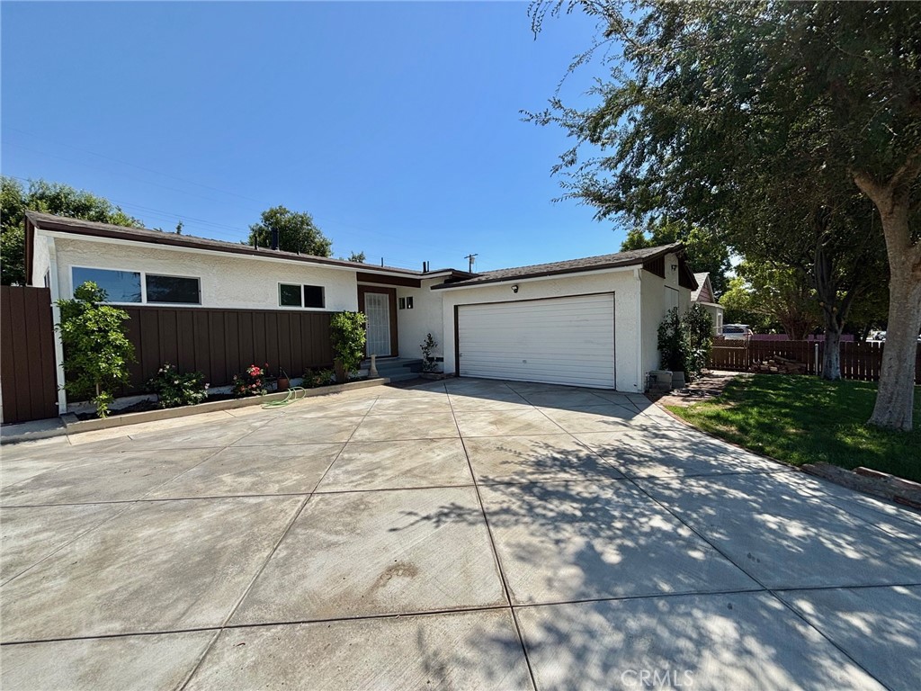 Welcome to this beautifully updated 3-bedroom, 2-bathroom home nestled on a desirable and quiet street in Arleta. Sitting on a spacious lot adorned with mature fruit trees—including avocado, pomegranate, and vibrant bougainvillea—this property offers both charm and comfort. Inside, you’ll find a fresh and modern living space featuring new flooring, dual-pane windows, updated kitchen and bathrooms, and fresh interior paint. The exterior has also been refreshed with new paint, insulation, and the brand-new driveway adds to the home’s great curb appeal. Perfect for entertaining or simply enjoying everyday life, this home is truly move-in ready. Plus, it’s conveniently located just minutes from freeways, shopping, and dining—making your commute and errands a breeze, and home school to the sought after Vena elementary school. Don’t miss the opportunity to make this beautifully updated Arleta home yours!
