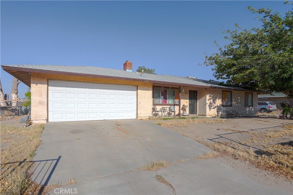 Ranch style living, far away from the city but close enough to commute to work, this home offers a spacious living room with formal dining room, three spacious bedrooms and two baths, an extremely large lot with over 42K sq ft which goes from street to street, all gated and ready to accomodate ranch living or large equipment parking, huge potential and priced accesibly - call your real estate agent today for a tour - this fine home is seeking a new homeowner to cal it "Home Sweet Home".