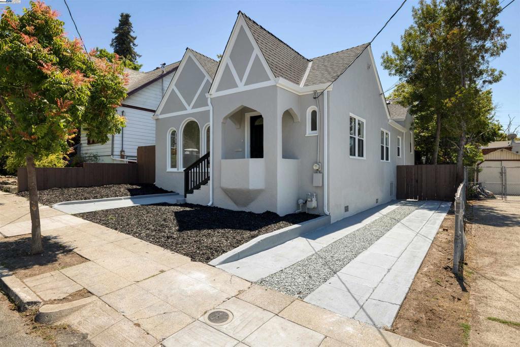 Beautiful tudor cottage style home in the Maxwell Park neighborhood, has been tastefully remodeled with a contemporary flare to highlight the traditional character and architectural traits of this homes style and floor design. Upon entry in to the large living area surrounded by traditional fireplace setting and arched Palladian style windows, the appreciated upgrades will impress contemporary mood highlighting a stunning transformation that includes breath taking color schemes; impressive baseboard/laminate flooring/door combination; kitchen remodel with white shaker cabinetry, gorgeous counter tops/back splash combo, new appliances brightened with LED canned lighting; beautiful island/cabinetry that separates but stunning arched opening to connect the kitchen and living room/formal dining area; remodeled primary bathroom and another half bathroom. Other highlights back yard with stunning deck setting, long driveway, partial finished basement area and updated laundry room. Rehab to the home includes rewiring/subpanel, replumbing, texture and paint of the interior and exterior of home, Kitchen and Bathroom, water heater, appliances, roof, partial fence and wall heating units.