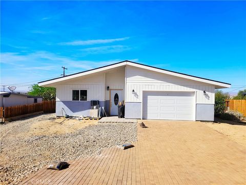 Photo of 74804 Serrano Dr, 29 Palms, CA 92277 (MLS # JT26068367)