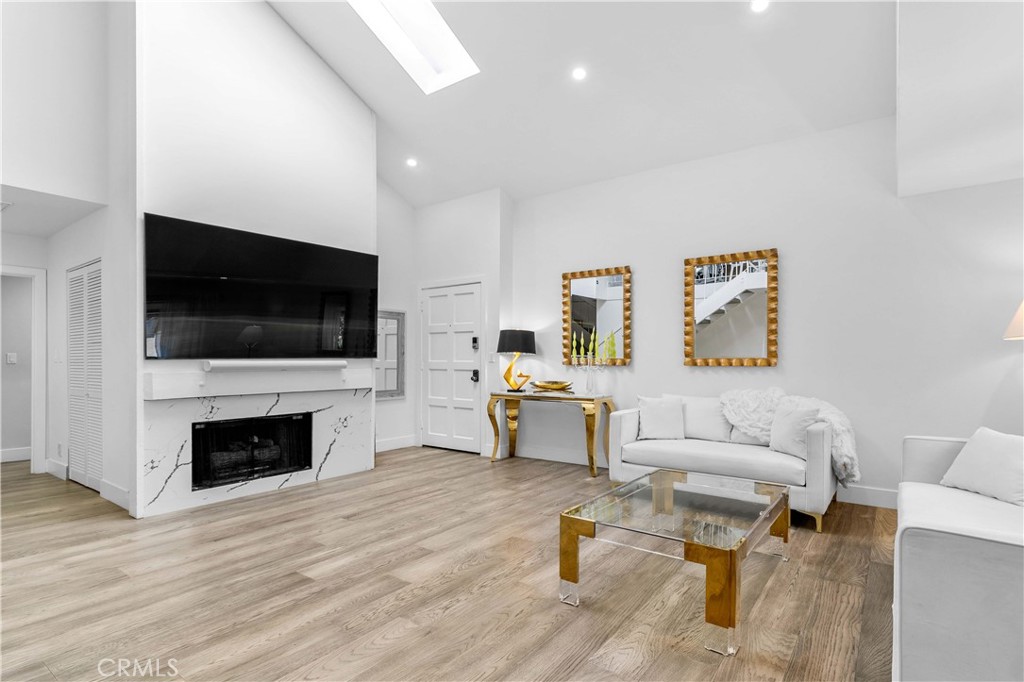 Welcome to this beautifully remodeled townhouse style condominium with 2 bedrooms+den, which can be used as a third bedroom, featuring an impressive layout, natural light throughout, and high-end upgrades.
The living room features high ceilings and skylights, creating a light and airy atmosphere. A large loft overlooks the living area and can easily be used as a third bedroom or private suite. The dining area sits comfortably beside the remodeled kitchen, which is equipped with top-of-the-line appliances, including a Samsung glass refrigerator. The kitchen also features new cabinetry, quartz countertops, and beautiful curtains that enhance the aesthetic throughout the property. Enjoy a good-sized balcony just off the dining and living areas—ideal for morning coffee or evening relaxation.
The master bedroom boasts soaring ceilings and a large window that fills the space with natural light. It includes central A/C, and a generously sized walk-in closet. Above the master bedroom, you'll find a spacious 200 sq. ft. storage area—perfect for holiday décor, extra toys, or other seasonal items. The en-suite master bathroom features dual vanities ("his and hers" sinks) and a spacious standing shower.
The second bedroom is also bright and roomy, offering plenty of natural light. In addition, there are two full bathrooms in the home for added convenience.
The home includes in-unit laundry with a newer Samsung washer and dryer, updated windows and doors, and is located in a community with a well-maintained HOA. The building has a brand new roof. This was a special assessment of $180 per month, created to fund a new roof for the building. It will end after two years
This property will impress even the pickiest of buyers—schedule a tour today!