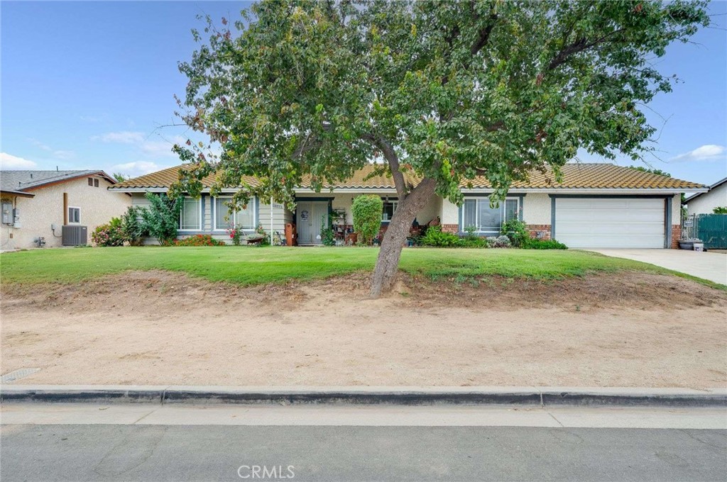 Welcome to this Sky Country Ranch Home! Ideally located in a premier spot within the tract near local schools, this residence offers both convenience and charm. Step onto the welcoming covered front porch and into more than 1,700 square feet of open, airy living space. The home’s large living room, family room, and dining area are finished with beautiful tile flooring designed with the warmth of natural wood. The kitchen is well-appointed, featuring abundant cabinetry, a spacious pantry, and ample room for cooking and entertaining. The primary suite is tucked at the rear of the home, offering peaceful mountain views, while a second oversized bedroom on the opposite side is perfect for guests. Two additional bedrooms are generously sized, providing flexibility for family, work, or hobbies. Amenities include central air and heat, newer carpet, a two-car garage, and the added benefit of paid-off solar for energy efficiency. Set on an expansive lot of more than 20,000 square feet, the property offers RV parking and horse facilities—perfect for equestrian enthusiasts. Sky Country Ranch is renowned for its equestrian-focused lifestyle, blending rural charm with the convenience of nearby city amenities. This is the best of both worlds: a spacious, well-appointed home in a community that embraces open land, horses, and mountain views.