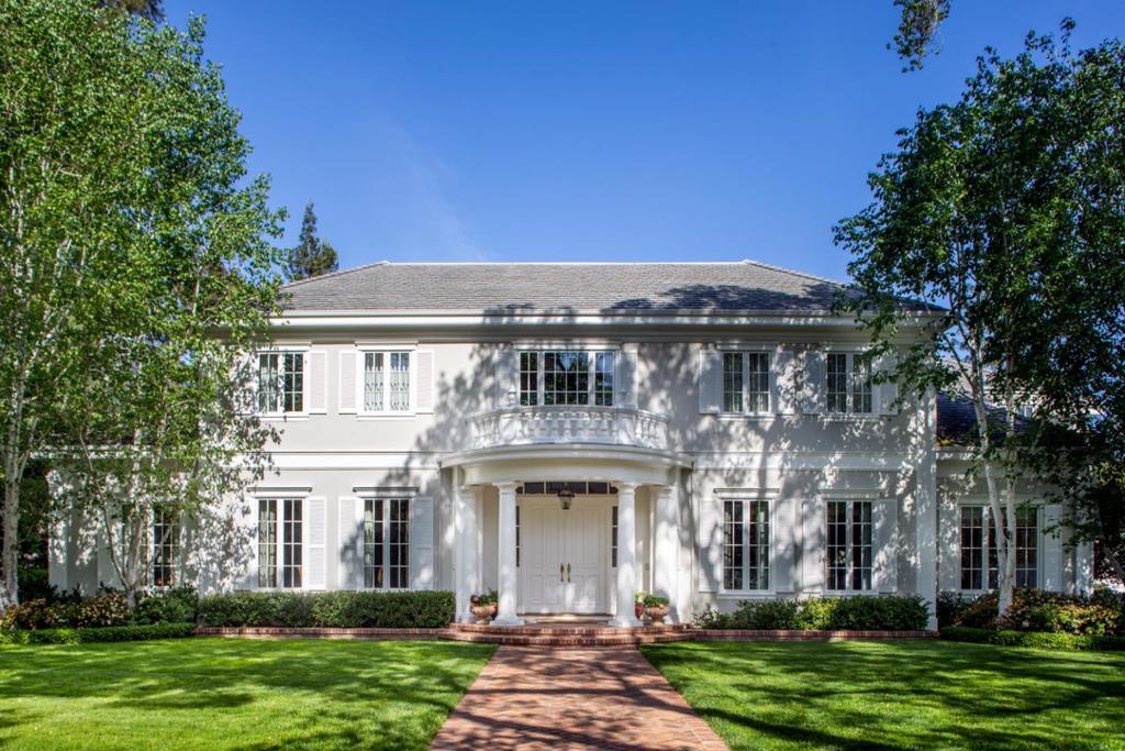 This Atherton estate presents absolute symmetry in design with timeless elegance and classic finishes throughout. On more than one acre of privacy, with dual gated entrances, the estates undeniable allure begins with its signature front portico and perfectly manicured landscaping predominantly in a palette of green and white. Inside, beautiful appointments include refined millwork, hardwood floors, and hand-selected marble in every bathroom. Tall ceilings and wide passageways enhance the spacious dimensions that span two levels with grand formal rooms for entertaining, a chefs kitchen, adjoining family room with full bar, and cherry-paneled library for work-from-home. There are 5 bedrooms, including a main-level suite, plus a studio guest house. The outdoor venues include a pool and spa, vast lawn, expansive terraces in hand-selected Connecticut bluestone, as well as a cabana with barbecue center and fireplace everything needed for the quintessential California lifestyle.