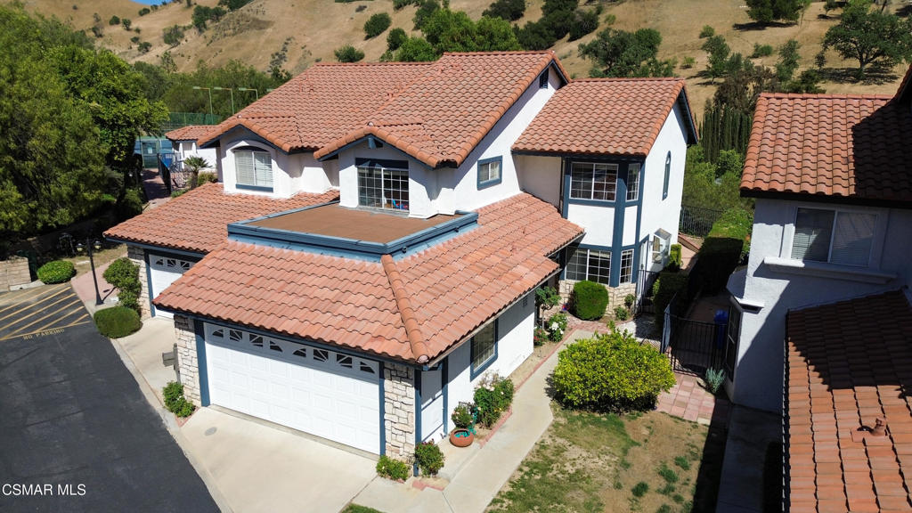 Tucked in the scenic hills of Malibu Canyon on a gate-guarded street, this 3-bed, 3-bath home offers privacy and prime amenities in a peaceful cul-de-sac within the award-winning Las Virgenes School District. This home is tenant-occupied through March 2026. The layout includes a spacious living room and dining area, both opening to a backyard patio with views of the surrounding hills. On the main floor, a versatile den with wet bar makes for a perfect home office, guest space, or bonus room, with direct access to the laundry area and 2-car garage. Upstairs, the oversized primary suite features an adjoining retreat space -- ideal for a workspace, reading nook, or nursery.As a bonus, this home sits just steps from the quiet community pool, spa, and tennis court, all maintained by the HOA.