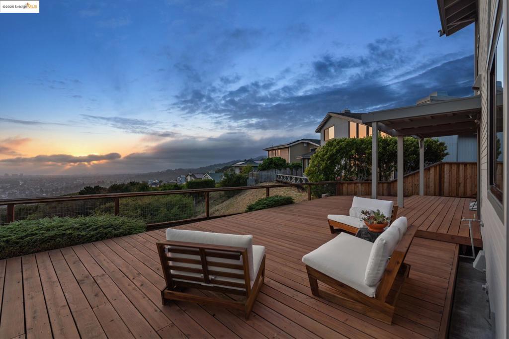 Breathtaking Golden Gate, Bay Bridge and San Francisco cityscape views define this stunning two-story sanctuary, featuring soaring ceilings and rich hardwood floors that flow through naturally lit main living spaces. The expansive eat-in kitchen with panoramic vistas flows seamlessly into a separate family room that opens to multiple outdoor decks perfect for watching spectacular sunsets paint the sky. Four bedrooms and 2.5 bathrooms include a generous primary suite with luxurious spacious bathroom. A thoughtfully designed separate wing provides flexible space for today's modern lifestyle needs. The huge lot with private side yard offers rare privacy and space in this prestigious community. Premium features include three-car garage, two fireplaces, air conditioning, updated appliances, designer colors and lighting throughout, laundry room, large closets, and ample storage. The community itself offers private security, sparkling pool, and neighborhood gatherings that foster genuine connections and diversity. Located minutes from parks, hiking trails, grocery stores and coffee shops yet feeling worlds away from the rush. This is luxury living meeting authentic community connection - something you didn't know you needed until you experience the magic of coming home here.