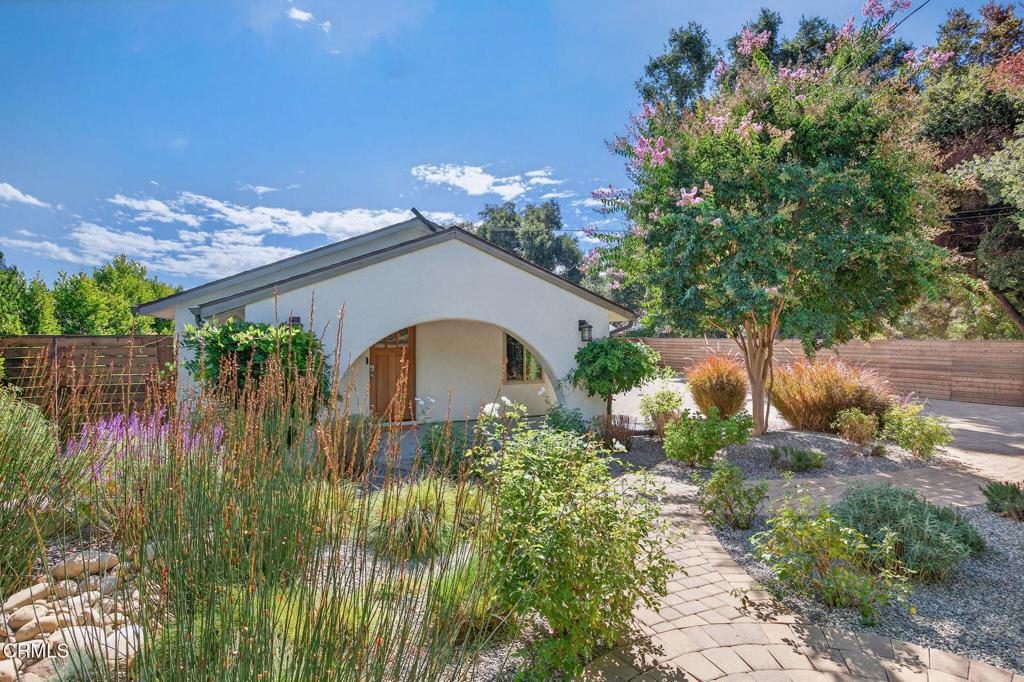 Welcome to your own private retreat tucked away in the vibrant community of Meiners Oaks! This beautifully remodeled, turn-key, 3 bedroom, 2 bath home blends modern comfort with Ojai charm, offering 1,456 sq. ft. of thoughtfully designed living space.Step inside to a bright, airy interior where dual-paned windows invite in natural light, beautifully complemented by recessed lighting in every room. At the heart of the home, the open-concept kitchen showcases sleek modern cabinetry, stainless steel appliances, and durable quartz countertops, anchored by a spacious island with abundant storage. Just off the kitchen, a well-appointed laundry room with custom cabinetry adds both style and convenience. The secluded primary suite is a true retreat, complete with an expansive walk-in style closet and an en-suite bath boasting a double vanity & generous shower with a full-width bench seat.The fully fenced property is a private sanctuary, offering plenty of usable space for entertaining or tranquil relaxation framed by vibrant crape myrtle trees and lush landscaping creating a sense of privacy and serenity. Unwind in Ojai's sunshine under the backyard pergola or take a dip in a unique Tipsy Tanks plunge pool--perfect for cooling off on warm afternoons. A solar-powered gated driveway provides secure parking for multiple vehicles, including RV parking for added flexibility. Notable upgrades include luxury System Pavers walkways and driveway, a security system, newer roof and HVAC system, ensuring convenience and peace of mind. Located just blocks away from gourmet restaurants, cafes, galleries, hiking trails, and schools, you'll enjoy all of Ojai's cultural events, while quick access to Highway 150 makes trips to Santa Barbara a breeze. Come see this beautiful home which merges functionality with charm, making it an ideal haven for anyone looking to plant roots in the vibrant community of Ojai.