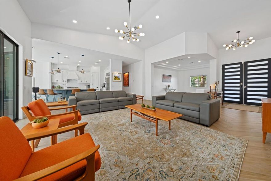 The owners have meticulously RENOVATED and REMODELED this exquisite home with today's CONTEMPORARY DETAILS. Almost too many upgrades to list but include full bathroom renovations, NEW THERMAL WINDOWS throughout, new AC/furnace, new TANKLESS WATER HEATER and OWNED SOLAR!!!! Former orange peel drywall now has smooth finish throughout. Located on a quiet CUL DE SAC within the gates of the beautiful Bermuda Dunes Country Club community featuring a highly regarded 18-hole private golf course. Excitement builds as you navigate the long walkway to the modern glass front doors and step onto the majestic wood plank style ceramic floors. Once inside, you sense refined sophistication. The 2 NEWLY ENLARGED WINDOWS off the kitchen/great room and sliding doors reveal pristine SOUTHERN VIEWS overlooking the sparkling pool and built-in OUTDOOR KITCHEN. The pool even comes with a chiller for those extra hot days! Chef-inspired kitchen with OVERSIZED ISLAND features a Sub-zero built-in glass door refrigerator, undercounter wine fridge and WOLF COMMERCIAL OVEN/RANGE. The primary bedroom on the East wing will be sure to impress the most discerning Buyer. Entering the primary bath, you will feel like you just stepped into a high-end spa with backlit mirrors, large walk-in shower, stand-alone soaking tub separating his & her vanities appointed with marble to the ceiling. Guest bedroom with ensuite bath & walk-in closet in the south wing. Jack & Jill bedrooms located in the west wing. Large laundry room. OVERSIZED GARAGE - park 4 cars! Natural gas firepit. Additional BOAT/TRAILER/RV PARKING SPACE.