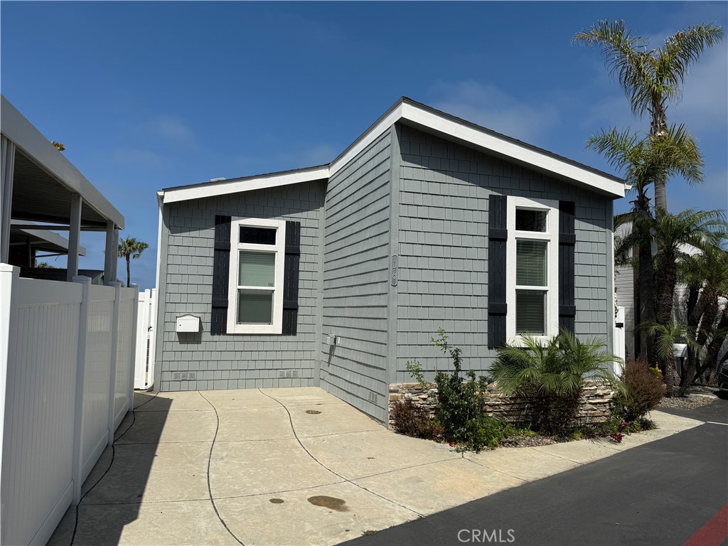 Incredible ocean views and sunsets await you in this coastal enclave in Laguna Village. This fully furnished home comfortably sleeps four in the 2 bedrooms, a walk-in closet in the primary room, one full and one half bath, a fully updated kitchen, a dining island, a dining area, and a sizable living area, and a desk. Enjoy the sizable deck with outdoor seating that is perfect for reading or watching the gorgeous sunsets, and a table for al fresco dining for 4. Private BBQ for your use, dedicated parking for up to 3 cars. All utilities, the community pool, spa, gym, and clubhouse are included in the lease. Available for a minimum of 6 months. Located across from the Montage Laguna Beach Resort and Treasure Island Beach, walking distance to Starfish, La Sirena Grill, Z Pizza, Rapport Coffee Roasters, Ruby’s Diner, O Japanese, close to the shopping mecca of Laguna Beach boutiques and all that Laguna Beach has to offer.