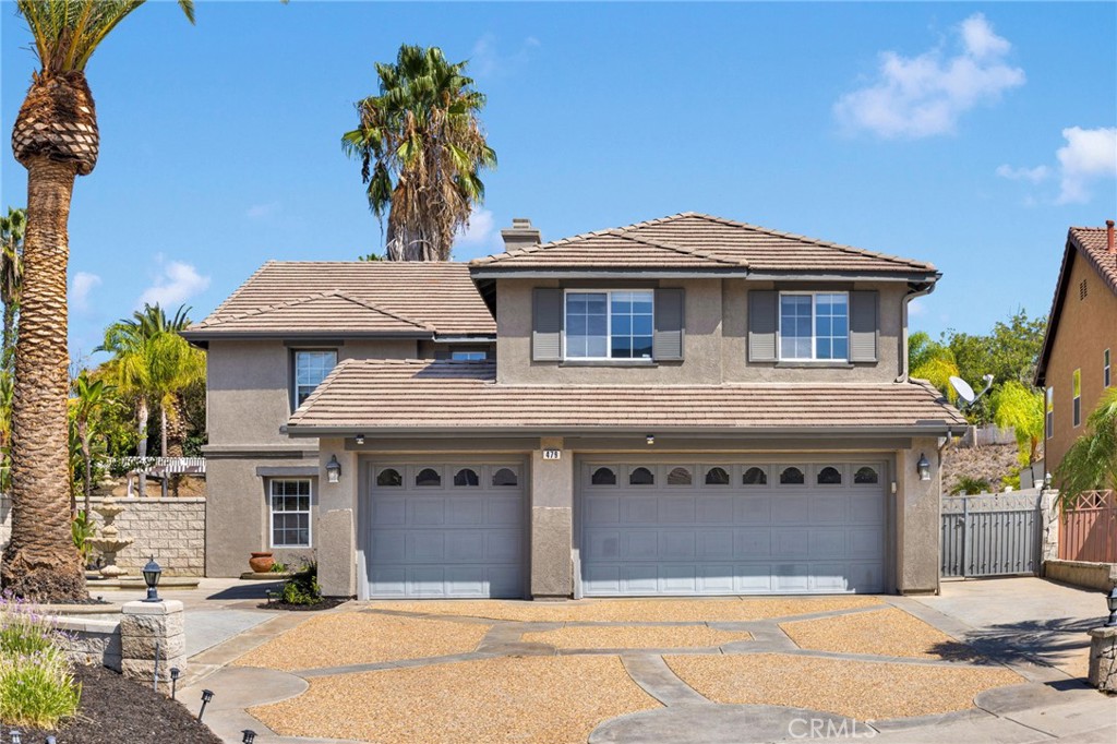 Welcome to 479 Adirondack located in South Corona in the highly sought after Mountain Gate community. No HOA, low tax rate approximately 1.187%. With excellent school ratings, walking distance via back gate to Citrus Middle school, this incredible 2 story home offers a sprawling 3,530SqFt of living space on a .44 acre of land, 5 bedrooms 3 full bathrooms with a breath taking entertainers dream backyard. Sitting on just under 20,000sqft Lot, the front exterior is well maintained and tastefully designed with plenty of concrete, RV parking, gorgeous curb appeal adorned with birds of paradise and palm trees throughout. The backyard is sure to set a standard offering pebble stone pool, shallow area for kids and adult relaxation, multiple waterfalls, grotto, custom rock design, spa, putting green, built in bbq, detached patio, fire pit and more. Upon entry through the doubled doors, you are greeted with a vaulted ceiling with chandelier, formal dining room, living room and enter into the family room, spacious kitchen which offers plenty of granite counter top space, cabinets and wine rack. The main level offers a full bedroom, full bathroom a must have with multi generational living. 2nd level offers spacious master suite, his and her sink, walk in shower, bathtub and walk in closet. 3 full size bedrooms, upstairs office area with built in cabinets including a loft outside the guest bedrooms. This magnificent property checks off all the boxes, welcome home.