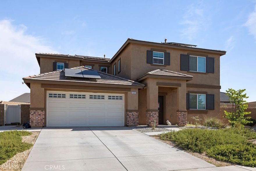 **RECENTLY REDUCED** Modern Comfort Meets Family Living in Oak Hills! Welcome home to this beautiful 4-bed, 3-bath residence offering over 2,500 sq ft of thoughtfully designed space on a generous quarter-acre lot. Built in 2022, this newer home features an open-concept floor plan with spacious living areas, high ceilings, and gorgeous upgraded flooring throughout. The modern kitchen is the heart of the home, complete with quartz countertops, stainless steel appliances, and custom cabinetry—perfect for family dinners and weekend gatherings. The stylish bathrooms, roomy bedrooms, and warm natural light make every corner feel inviting and comfortable. Step outside to enjoy your brand-new $25K covered patio—ideal for BBQs, playtime, or relaxing evenings under the desert sky. The home is powered by a full solar system with a Tesla Powerwall, ensuring energy efficiency and peace of mind with no outages or blackouts. Conveniently located and priced as the lowest-priced home over 2,500 sq ft built in 2022 or newer within a mile, this property is a rare find. Modern, efficient, and move-in ready—this Oak Hills gem is the perfect place for your family to call home!