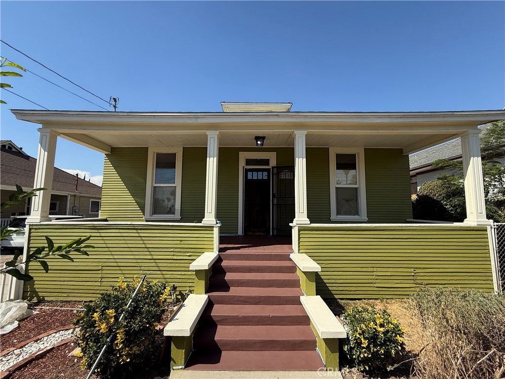 Who says there isn't affordable housing? We have a wonderful house for you to call home. Built long ago with 100+ year old charm and a proper yard, white picket fence and an enclosed rear yard. This historic home has the charm of yesteryear yet the modern amenities needed for modern life. As you come up the steps to the front porch you will enter the home and find a cozy 2 bedroom house with nice large living room, 10 foot ceilings, dining room, kitchen and bathroom. The kitchen is located to the rear of the house and is equipped with Stove, microwave and a new barn sink. Has a cute walk in pantry too. The kitchen is sunny and bright. The original doors, and base boards are still going strong in this house. Over the years the house has been remodeled and upgraded as needed. There is a mud room/ laundry room with a newly added bathroom/shower area and the attic can be used as playroom , storage, or additional living space. Fresh paint through out the house, newly remodeled bathroom with new sink, toilet and shower enclosure. The house is equipped with modern amenities like central heating and air conditioning system, an energy efficient roof that was installed about 7 years ago. Home is equipped with a tankless water heater and solar panels. There is a huge 4 car garage fully permitted and a fenced back yard with lemon tree, apple tree too. Garage could be converted into an ADU. It measures approximately 22x38. It is a good large size. There's even room to park your RV or trailer. Located within an easy commute off the 210 freeway, walking distance to the local schools. Highland sits at the base of the San Bernardino Mountains. You can be to Pasadena, Lake Arrowhead or Palmsprings in 45 minutes. Property is well located to good shopping , coscto, smart & final, and for fun the Morongo casino and resort is minutes away from this home.