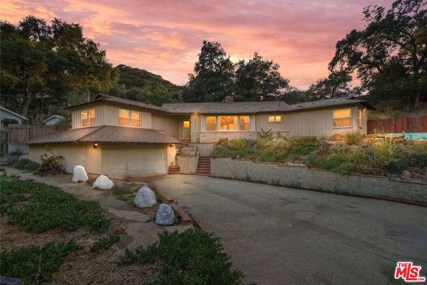 Truly unique home nestled in the hills of Tujunga! This large, gated property offers the perfect blend of privacy, space, and character, set against a backdrop of trees and scenic hillside views. Step inside to find a spacious, light-filled layout with original details and an inviting atmosphere that makes you feel right at home. The expansive living areas seamlessly connect to a thoughtfully designed kitchen, ideal for both everyday living and entertaining. Generous bedrooms, ample storage, and updated bathrooms add to the home's appeal. Each bedroom has its own bathroom! Step outside to enjoy the peaceful yard space perfect for evening gatherings, or simply unwinding in nature. But the true hidden treasure lies below: a gigantic basement area that must be seen to be believed. Whether you envision a dream workshop, creative studio, entertainment haven, or additional living space, the possibilities are endless. This unique feature sets the property apart and offers exceptional value for those seeking versatility. Don't miss the opportunity to own this one-of-a-kind property! Schedule your private tour today!