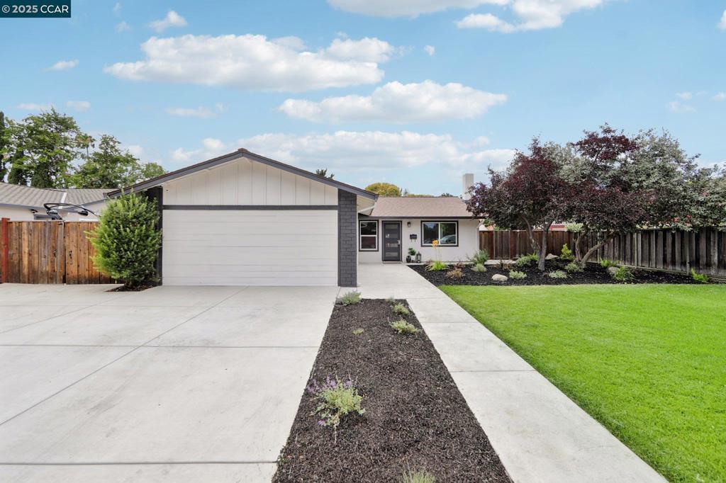 For the most discerning buyers that want NEW finishes. Welcome to this fully remodeled, move-in ready 4-bedroom, 3-bath home located in the highly desirable Summerset community of Livermore! Flexible floorplan with an attached ADU and thoughtfully upgraded throughout, this home features an open-concept floor plan perfect for modern living with neutral paint, durable yet beautiful luxury plank flooring and recessed LED lights. The stunning kitchen boasts brand-new cabinets, quartz countertops, sleek appliances, and a large dining area for gatherings. Bright, airy living spaces flow seamlessly, ideal for entertaining or everyday life. The spacious primary suite and all three of the stylish bathrooms have been thoroughly updated. You'll appreciate the bonus mudroom offering TONs of added storage capacity or even can flex as a mini-office. A garage conversion adds a flexible ADU/in-law suite with its own private entrance and direct access to the main home—perfect for multigenerational living, guests, or rental income. Outside, enjoy a large, freshly landscaped front and back yards with new sprinklers, enhancing the curb appeal. Large side yard with hardscape/possible RV parking/carport. Move right in and enjoy all that Livermore living has to offer!