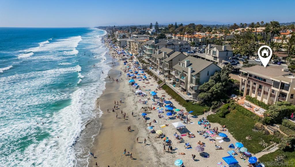 Experience unparalleled coastal living, an extraordinary oceanfront property spanning 75 feet of ocean frontage, nestled in the heart of Carlsbad Village. This premier location grants you immediate access to the finest dining, shopping, and coffee shops, making it a hub for a vibrant lifestyle. Positioned directly on one of the most coveted sandy beaches along the coast, this estate offers breathtaking ocean views from nearly every room and direct beach access. The oversized outdoor decks are perfect for hosting extravagant oceanfront events, weddings, and endless entertainment. Approximately 4,564 square feet on a generous 10,473 square-foot lot, this beach compound features six bedrooms, plus two optional bedrooms, and seven full bathrooms. Crafted with a focus on maximizing stunning ocean vistas, the interior boasts a custom kitchen with floor-to-ceiling windows, a spacious living area with a cozy fireplace, multiple courtyards and decks, an outdoor shower, an attached three-car garage, and incredible privacy. Whether you are looking for a coastal compound, investment opportunity, or both, your oceanfront oasis awaits!