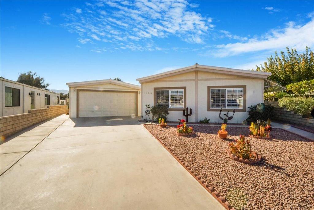 Looking for a slice of paradise without breaking the bank? Check this out: for just $400 a month in HOA fees, you'll enjoy a treasure trove of perks! Imagine having full cable TV, internet, trash service - worth over $200 alone! Plus, unlimited free Golfing for all owners! It's like living at a resort, but without the hefty price tag. Tucked away at the end of a charming cul-de-sac, this unique oversized pie-shaped property is all yours - no rent, no lease, just pure ownership! Step inside your completely remodeled home that's been thoughtfully updated over the past year and a half. You'll be welcomed by a fresh, open space filled with natural light, a brand-new 5-ton A/C system, and a fully owned solar system (3.2 kW) that's ready to keep those utility bills low. Stylish touches like recessed lighting, trendy barn doors, new flooring, revamped bathrooms, and a gorgeous kitchen with all-new appliances make this place feel like a breath of fresh air. Plus, it's wheelchair accessible, ensuring everyone feels at home here. One of the standout features is the massive, fully fenced backyard that boasts breathtaking mountain views. It's perfect for unwinding after a long day or hosting gatherings with friends around the extra-large wood-burning fire pit and two inviting sitting areas. And since it backs onto RV storage, you get that extra layer of privacy - how nice is that? Got hobbies or need space for your cars and golf cart? You'll love the enormous, detached garage (around 1,250 sq. ft.)--it's perfect for storing all your toys and even has a workshop area for your projects. Plus, with a permanent foundation (433A) already in place, financing this gem is a breeze. Don't miss out on this incredible opportunity! Schedule your private showing today and discover what makes this property so special. You won't regret it!