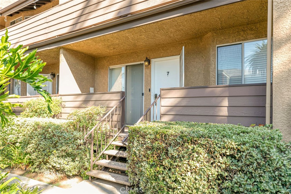 Location, Location. Fully Upgraded 2 bedrooms and 1.5 bathrooms condominium, 837 sq ft. Corian Counter tops, recessed lighting. hardwood floors, mirror sliding closet doors. Private Laundry room with washer and dryer. next to 2 car garage tandem underneath condo. Gated community with main entrance and small gate right in front of unit, 3 steps away from Condo entrance. Excellent location East of 405 Freeway.