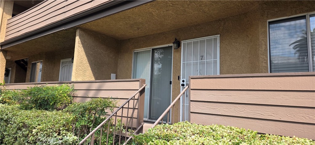 Location, Location. Fully Upgraded 2 bedrooms and 1.5 bathrooms condominium, 837 sq ft. Corian Counter tops, recessed lighting. hardwood floors, mirror sliding closet doors. Private Laundry room with washer and dryer. next to 2 car garage tandem underneath condo. Gated community with main entrance and small gate right in front of unit, 3 steps away from Condo entrance. Excellent location East of 405 Freeway.