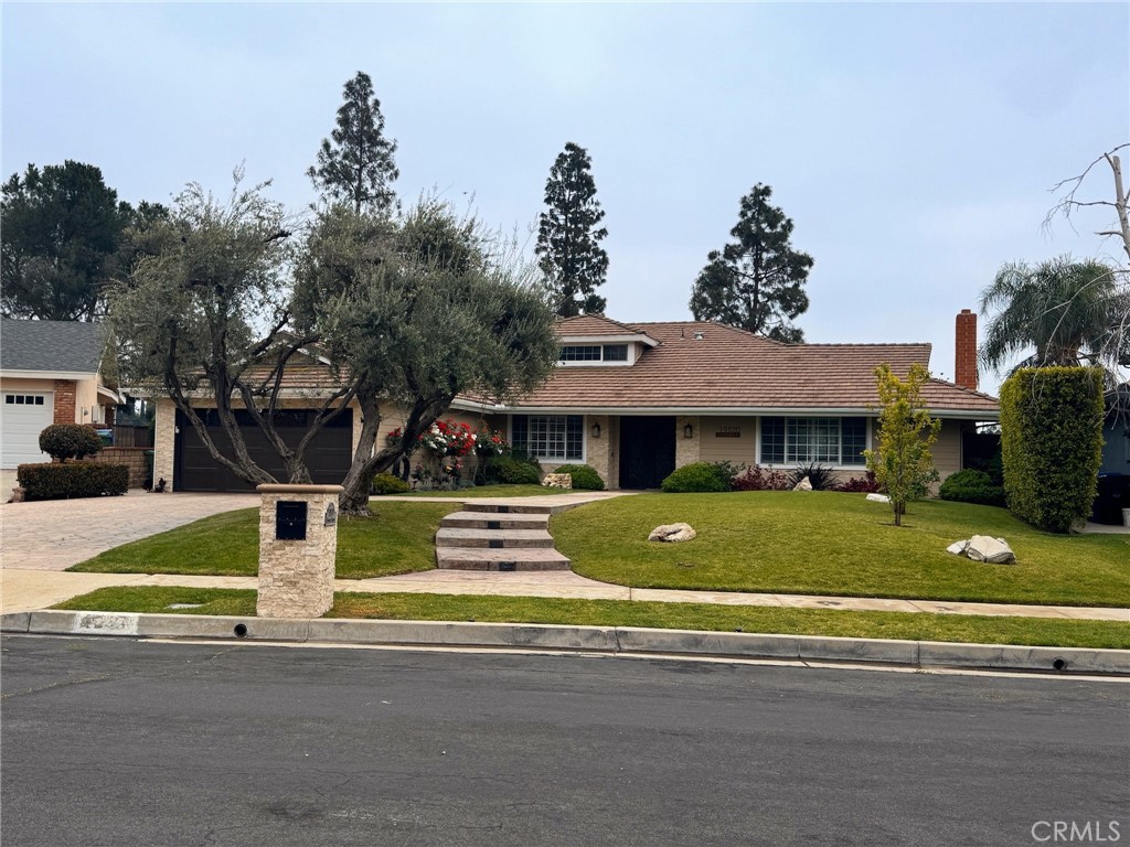 Stunning Smart Home in Porter Ranch
Nestled in a serene Porter Ranch cul-de-sac, this 4,005 sq. ft. smart home on a 13,794 sq. ft. lot offers breathtaking city lights views. Built in 1968 and meticulously updated, it features solar panels, potential for a JR ADU, and a versatile upstairs loft with a second primary suite.
Enter through elegant iron and frosted glass double doors, greeted by lush landscaping and a stamped concrete path. The tiled entry flows into an open-concept layout with bamboo floors, crown molding, and plantation shutters. The formal living room boasts a stone fireplace, built-in cabinetry, and abundant natural light.
The gourmet kitchen shines with ceiling-height cabinetry, granite countertops, custom tile backsplash, and stainless-steel appliances, including an electric cooktop, double convection oven, and dishwasher. Enjoy meals at the breakfast bar or in the bright nook with designer fixtures, opening to the backyard. The formal dining room, with built-in breakfront and designer lighting, is perfect for hosting.
The family room, ideal for a JR ADU, features a wet bar, window seating, and plantation shutters. The primary suite offers a stone fireplace, walk-in closet, arched window seating, and a sliding door to the yard. Its spa-like en suite includes dual vessel sinks, a jetted tub, multi-head shower, and stone tile floors. Two downstairs bedrooms have mirrored closets and bamboo floors, complemented by a stylish guest bath and powder room.
Upstairs, the loft with engineered hardwood, designer lighting, and a wet bar is an entertainment haven, adjacent to a second primary suite with a frameless tiled shower. Modern amenities include tankless water heaters, dual HVAC, copper plumbing, LED lights, and dual-pane windows.
The backyard oasis features a heated pebble-bottom pool and spa, outdoor kitchen, covered patio, pergola, and lush landscaping, all framed by stunning views. With parking for 6 cars and top-rated schools like Chatsworth Charter High, Nobel Middle, and Sierra Canyon nearby, this sustainable, luxurious home is move-in ready.