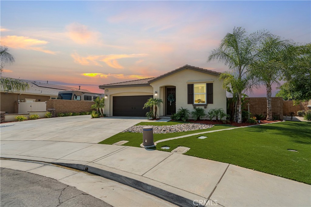 Welcome to this one-of-a-kind single story home at the end of a cul de sac with amazing views and RV parking!! Beautifully upgraded 3-bed, 2-bath Menifee hilltop home where the views are just as impressive as the upgrades. From sunrise to sunset and even under the stars you'll enjoy the spectacular panoramic scenery this lovely home has to offer. Come 4th of July, you'll even have front row seats to the firework show without ever needing to leave. The moment you step inside, you’ll find high-end laminate flooring throughout the home, complemented by upgraded baseboards for a modern, polished look. The interior has been refreshed from floor to ceiling, and the exterior has been freshly painted, giving the whole home a bright, welcoming feel. The living room features custom shelving, plantation shutters and a gorgeous stone fireplace, adding both style and elegance. Outside, the concrete driveway has been extended to include RV parking and the backyard has been completely renovated with lush grass and a full irrigation system. The spacious patio cover features two ceiling fans with lights, six additional built-in lights, and convenient outlets on both sides, making it a perfect space for entertaining or relaxing. This home is equipped with 28 solar panels and two Tesla backup batteries for all your energy needs, plus a Tesla charger already installed in the garage for your convenience. The garage also features an epoxy floor finish and extra acks overhead for all of your storage needs. This home is a rare gem in the heart of Menifee that is close to shopping, schools, golf course, hiking trails, lots of parks and so much more! This home combines many modern upgrades with some fresh new additions and plenty of room to play — don’t miss the opportunity to make it your own!