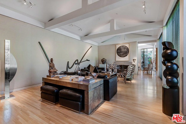 Featured in Architectural Digest, this stunning Beverly Hills estate is a haven of calm. Set behind gates amidst exquisite landscaping, the contemporary, single-level residence is the long-time home of an Architectural Digest Top 100 Designer. Wonderful flow, mellow light, and luxurious appointments - what Australian Vogue called an "oasis of calm". Spacious step-down living room with high ceilings is ideal for entertaining. Intimate media room/den and dining room are equally inviting spaces. Butler's pantry opens to a marvelous galley kitchen. Three en-suite bedrooms include luscious master suite, with Thai-silk walls and dual baths. There is also a maid's room with bath and a guest suite with separate entrance. Wide windows and doors provide access to the expansive, private patio, with pool and spa, ample room for al fresco dining and entertaining, and outdoor living room with a fireplace.