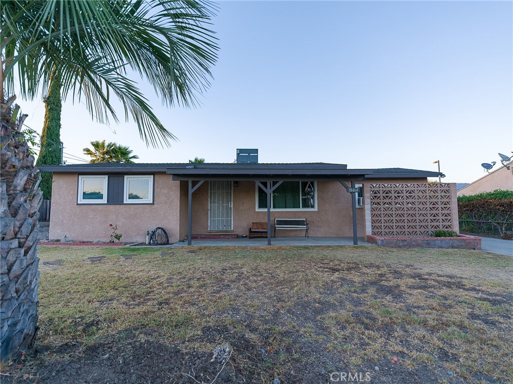 Welcome to this charming 2-bedroom, 1-bath home in Rialto with a versatile bonus room and a detached 2-car garage. Sitting on a spacious 10,160 sq. ft. flat lot, this property offers ample parking with two driveways—one fully paved and one unpaved, ideal for utility vehicles or RV parking. The detached garage also presents excellent potential for an ADU conversion (buyer to verify). Recent updates include fresh paint on kitchen cabinets, a brand-new AC/heating system, and a recently replaced roof. Outdoor living is enhanced with a built-in BBQ in the backyard. Additional features include laundry in the garage, septic system, and close access to main roads and the 210 freeway. Located in an unincorporated area of Rialto, with Wilmer Carter High School’s field conveniently behind the property. A great opportunity with space and flexibility!