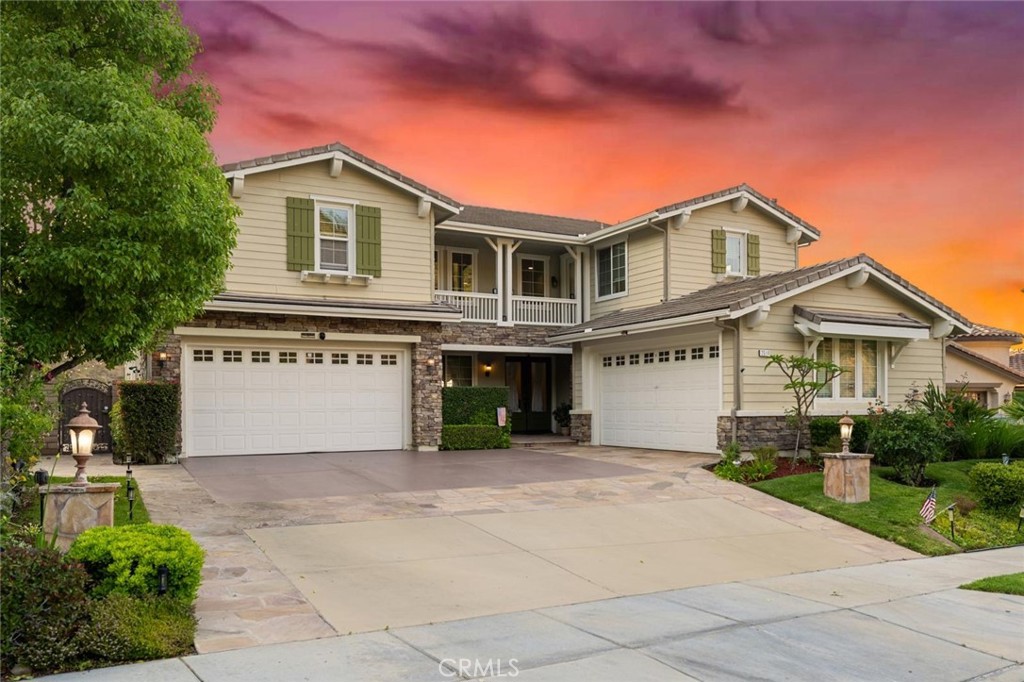 Welcome to the exclusive gated community of Sierra Peak, where luxury meets breathtaking natural beauty at the base of the Santa Ana Mountains, just moments from Yorba Linda.This stunning 4,878 sq. ft. home features 6 bedrooms, 5 full bathrooms (including 2 bedrooms and 2 baths on the main level), a game room, and a hobby room—designed to provide both comfort and flexibility for modern living.
The backyard is a true entertainer’s paradise, showcasing sweeping canyon, mountain, and city-light views. Resort-style amenities include a Pebble Tec rock saltwater pool and spa with waterfalls and slides, a California-style room, covered patio, gas fire pit, expansive deck areas, and beautiful flagstone finishes. Inside, elegance greets you at every turn. The grand double-door entry opens to soaring two-story ceilings, diamond-patterned marble floors, an impressive dual-access staircase, rich wood flooring, and crown molding. The spacious family room flows seamlessly into the gourmet kitchen with re-stained cabinetry, granite and slate stone surfaces, stainless steel appliances, center island seating, and a large walk-in pantry.
The luxurious primary suite offers a private retreat with dual walk-in closets, a spa-inspired bath with fine stone finishes, a Roman tub, oversized shower, and a private balcony perfect for enjoying the panoramic views. Situated at the end of a single-loaded cul-de-sac at the community’s highest elevation, this property also boasts a split 4-car garage. Its location offers unmatched convenience with easy access to the 91 Freeway, 241 Toll Road, Metrolink, Orange County’s premier destinations, and endless outdoor recreation along the Skyline trails.
Experience the perfect blend of luxury, convenience, and natural beauty in this extraordinary Sierra Peak residence.